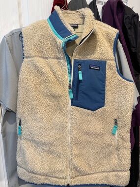 Patagonia Cream Sherpa Vest with Blue Chest Pocket and Teal Accents